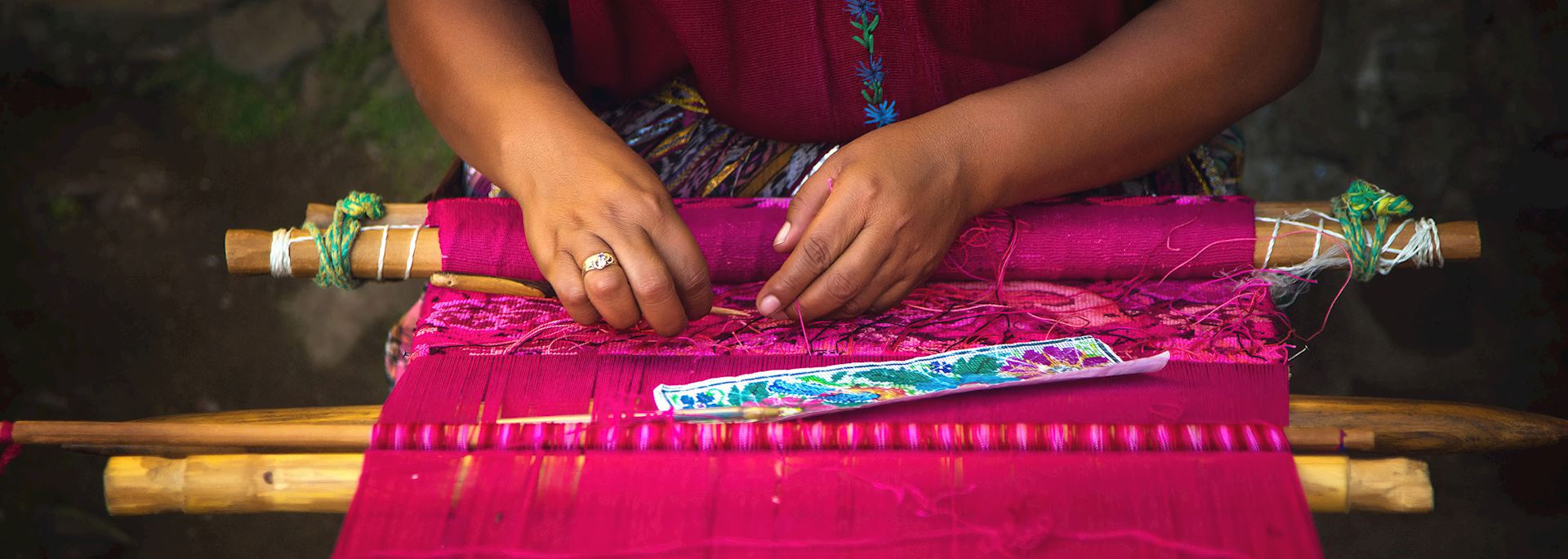 Woman weaving on a loom in Guatemala